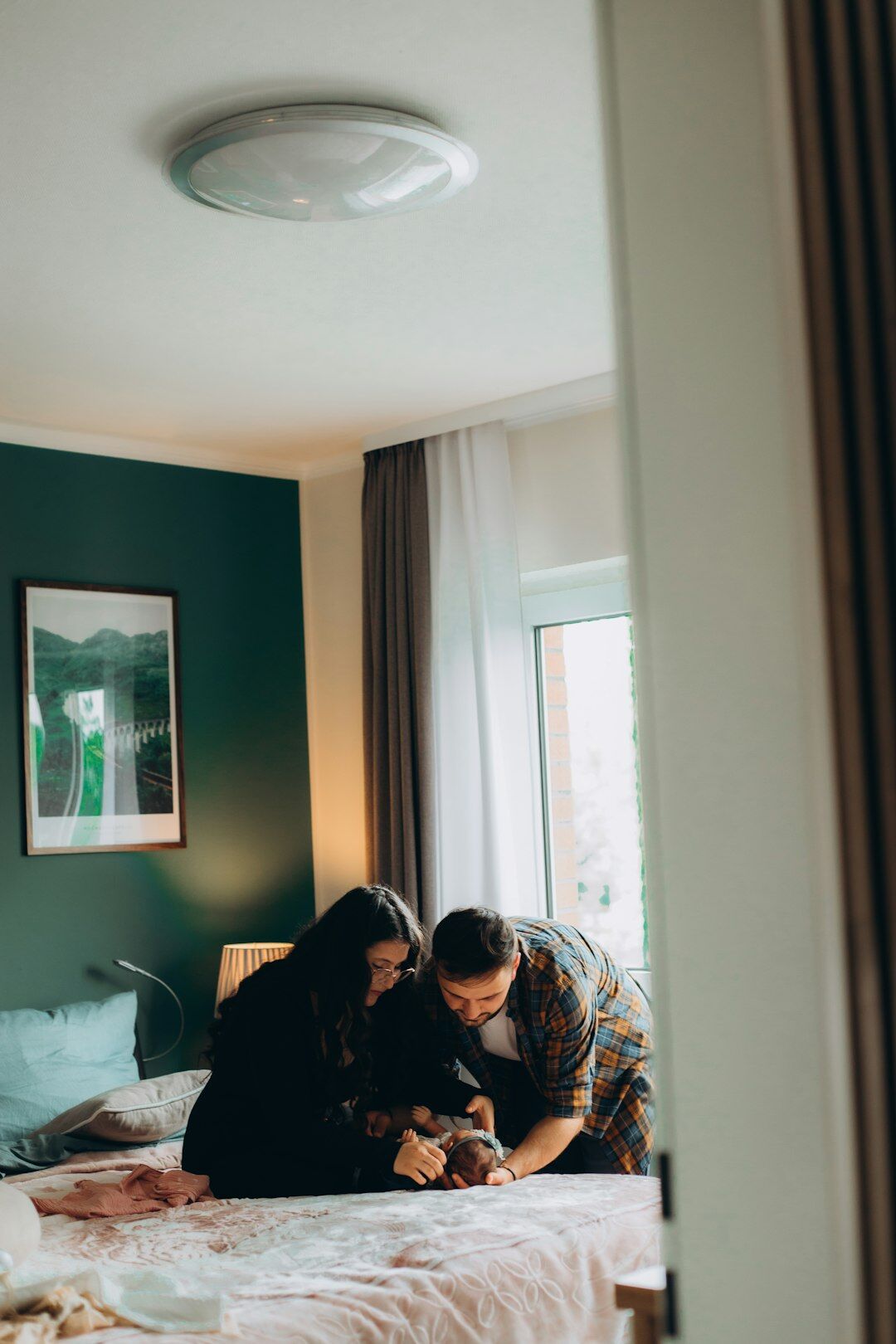 Middle-aged couple reviewing paperwork together at home