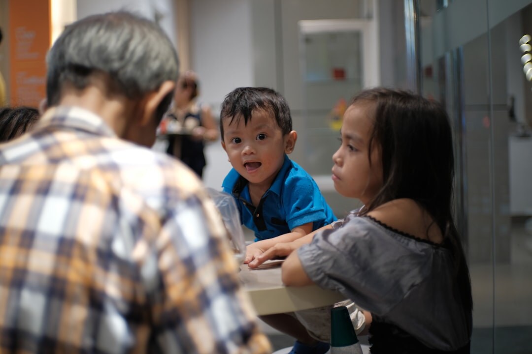 Adult siblings discussing documents together at a table